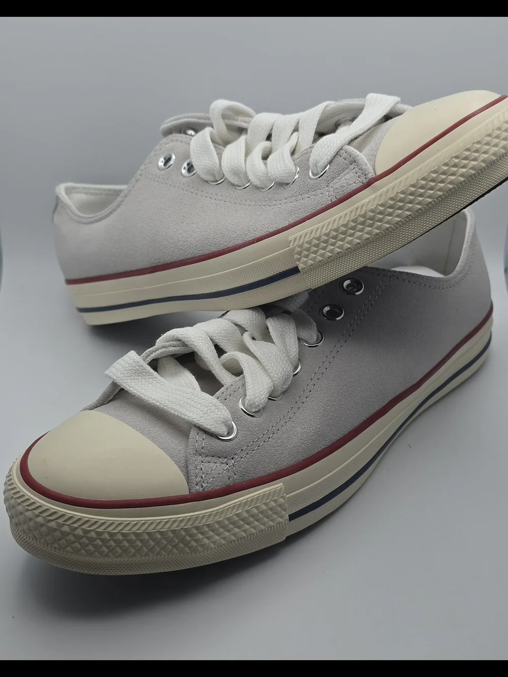 Converse Low-Top Sneakers in Light Gray with Cream Soles and Red/Navy Stripe